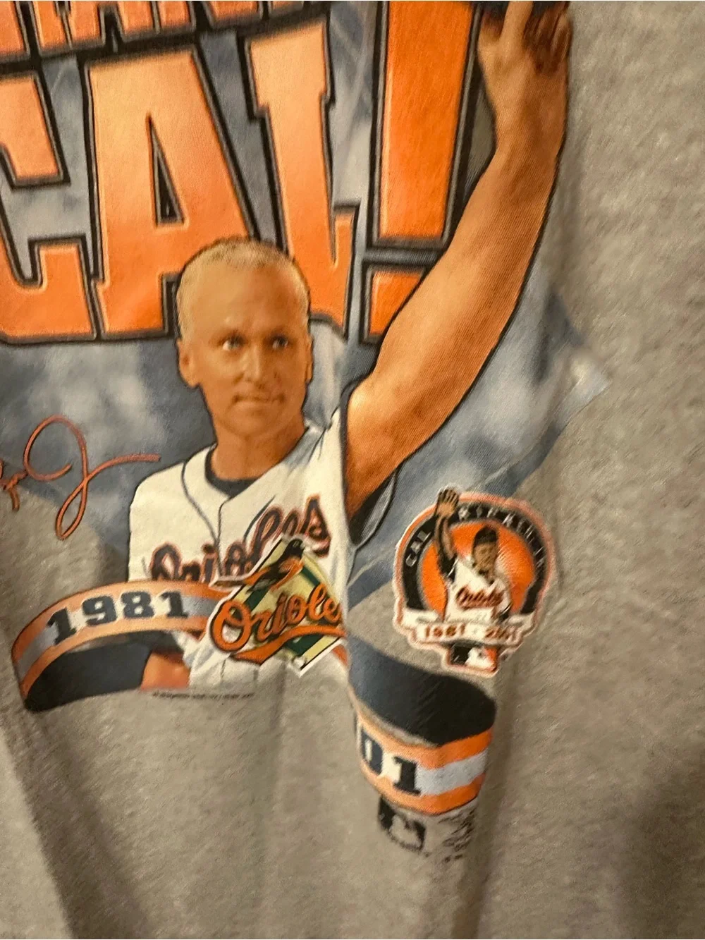 Lee Gray Tee with Orange & Navy Baltimore Orioles Tribute Graphic to Cal Ripkin